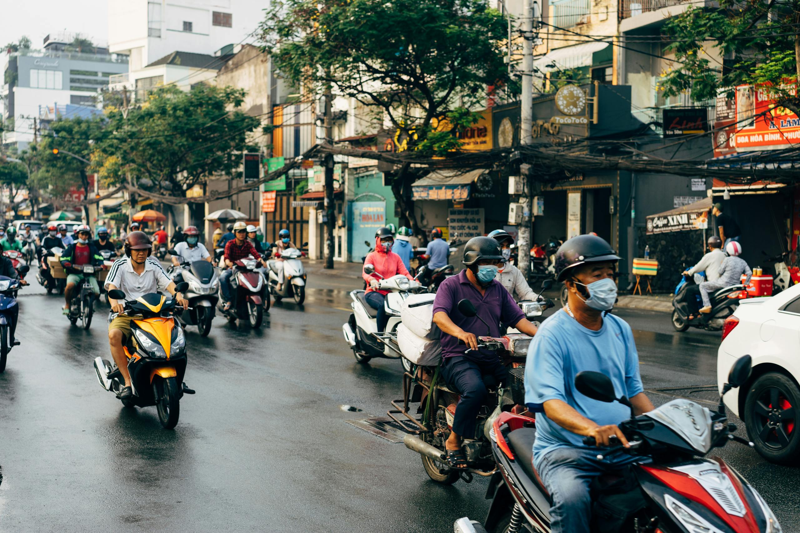 Vibrant scene of motorcyclists in Ho Chi Minh City, Vietnam, showcasing urban traffic flow.